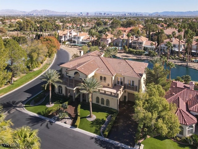 birds eye view of property with a mountain view