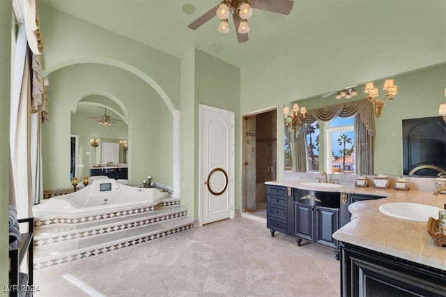 bathroom featuring tile patterned flooring, vanity, ceiling fan, and independent shower and bath