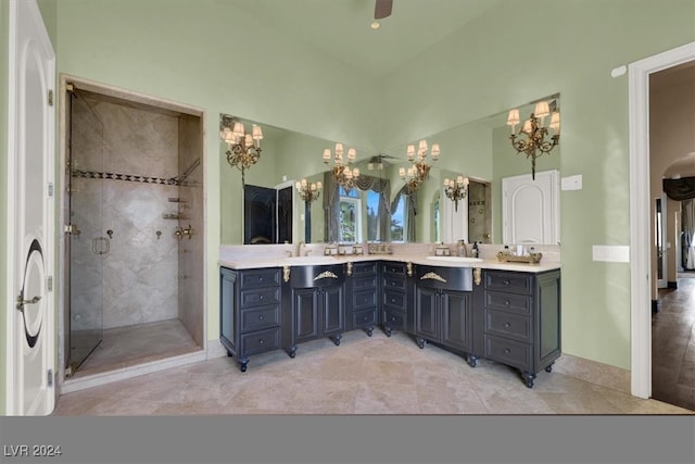 bathroom with vanity, tile patterned floors, and a shower with door