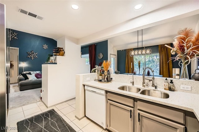 2133 Desert Pines St, Las Vegas, NV 89134 - kitchen with white dishwasher, a sink, light tile patterned floors, light stone countertops, and recessed lighting