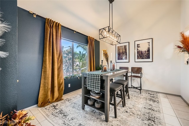 tiled dining room with lofted ceiling