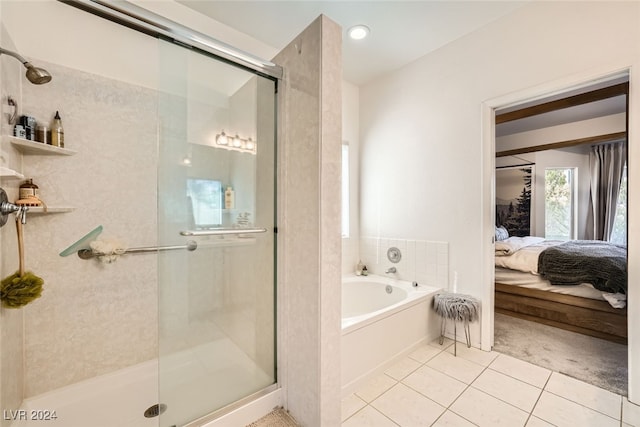 bathroom featuring plus walk in shower and tile patterned flooring