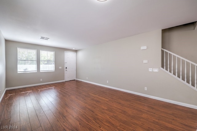 empty room featuring dark wood-type flooring