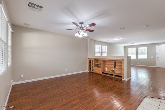 spare room with hardwood / wood-style flooring and ceiling fan