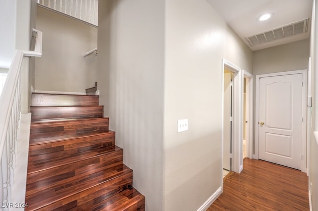 staircase featuring hardwood / wood-style floors