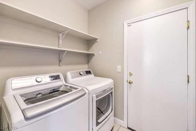 clothes washing area featuring washing machine and dryer