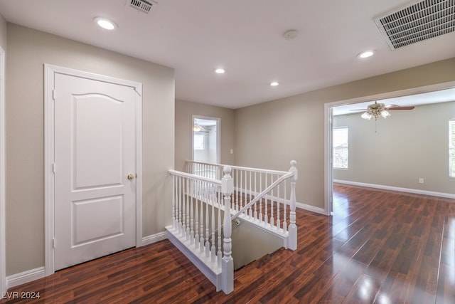 corridor with dark wood-type flooring