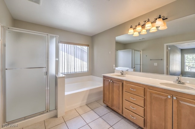 bathroom with shower with separate bathtub, vanity, and tile patterned flooring