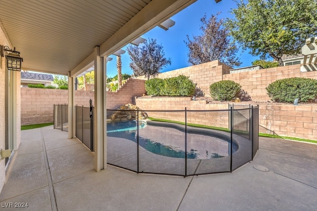 view of swimming pool with a patio area