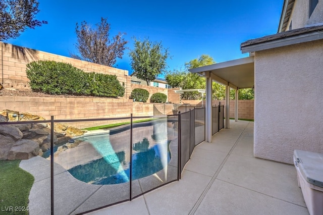 view of swimming pool with a patio