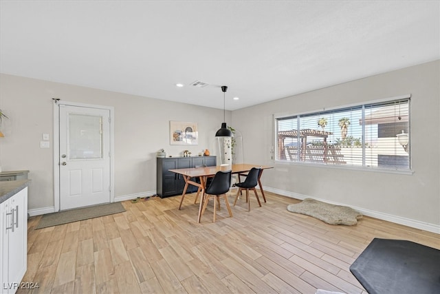 dining space with light hardwood / wood-style floors