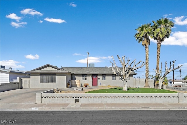 ranch-style house with a front lawn