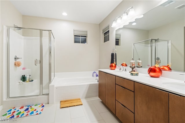 bathroom with tile patterned floors, separate shower and tub, and vanity