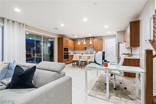 living room with light tile patterned flooring and sink