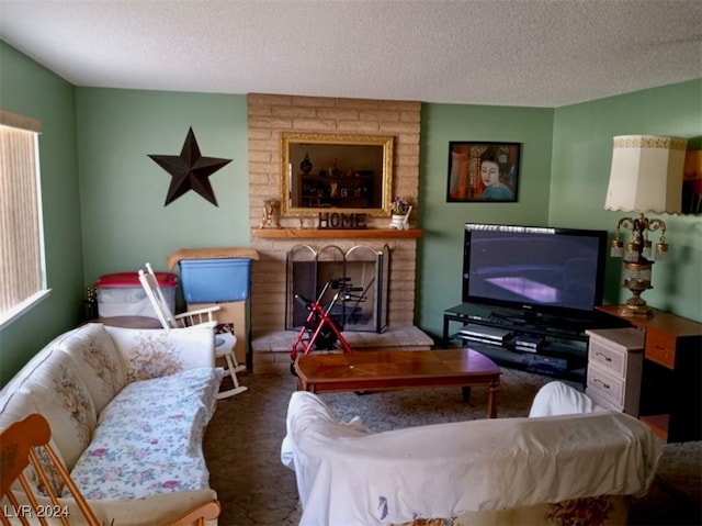 carpeted living room featuring a textured ceiling and a fireplace