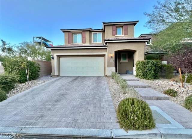 view of front of property featuring a garage