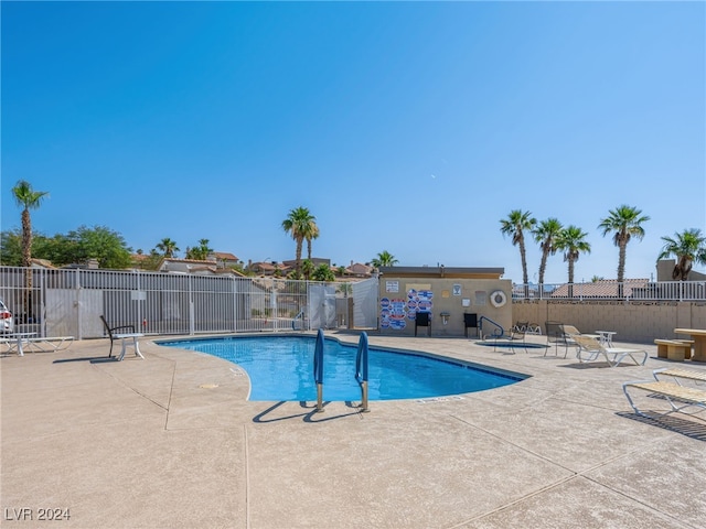 view of pool featuring a patio