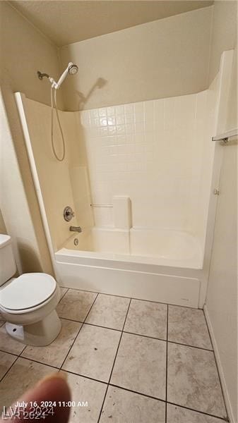 bathroom with tile patterned flooring, toilet, and shower / bathtub combination