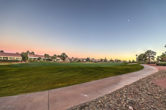 view of property's community featuring a yard