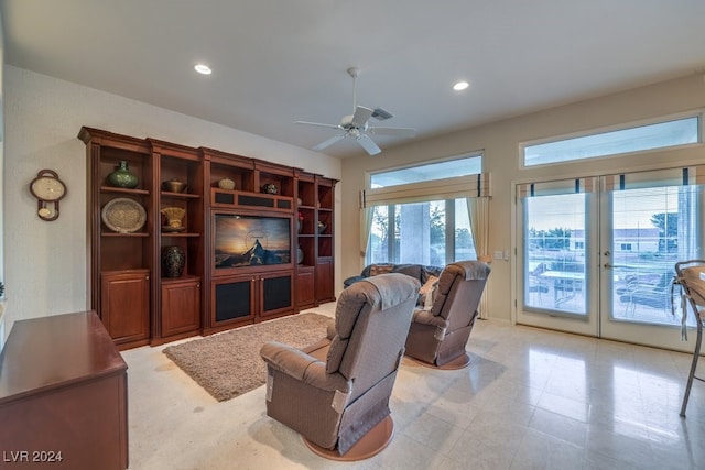 living room with ceiling fan and french doors