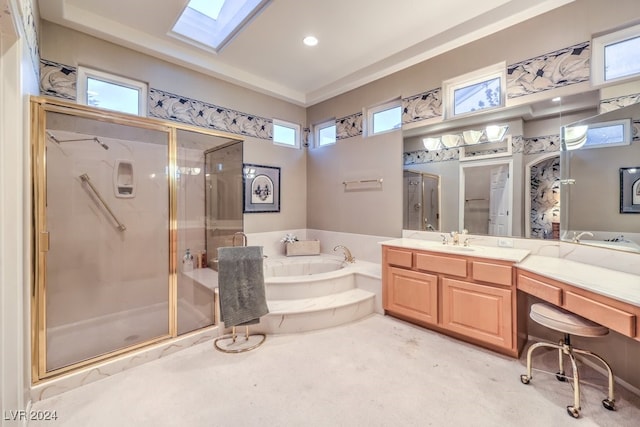 bathroom with a skylight, a healthy amount of sunlight, and separate shower and tub