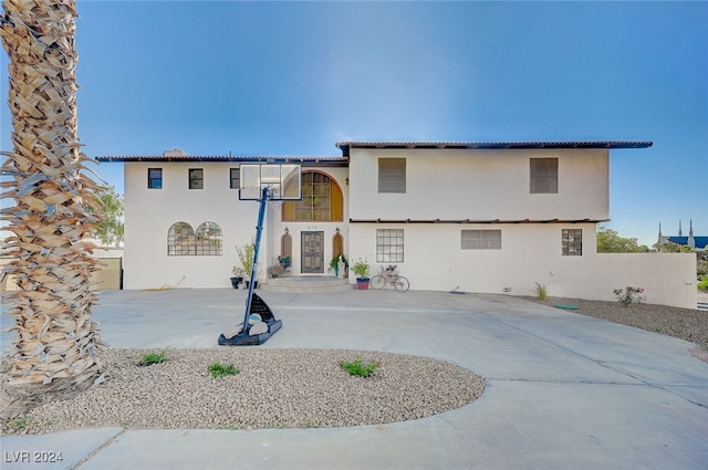 back of property with a patio area