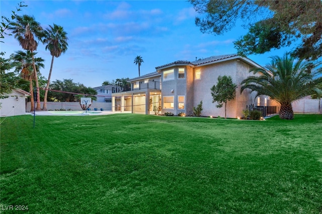 view of yard featuring volleyball court, a patio, and a balcony