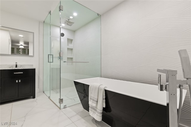 bathroom featuring vanity and plus walk in shower