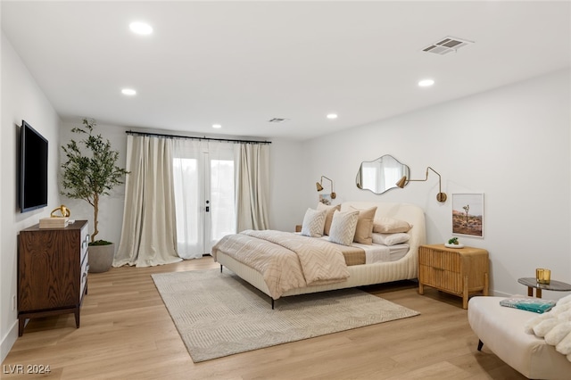 bedroom with light hardwood / wood-style floors