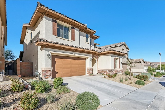 mediterranean / spanish-style home featuring a garage