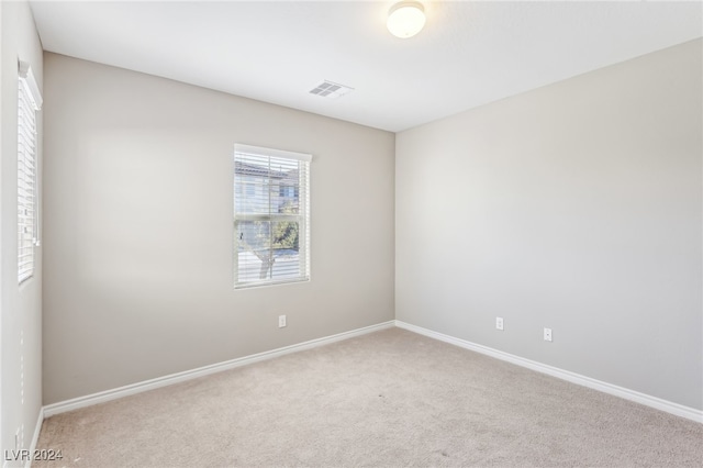 empty room featuring carpet flooring