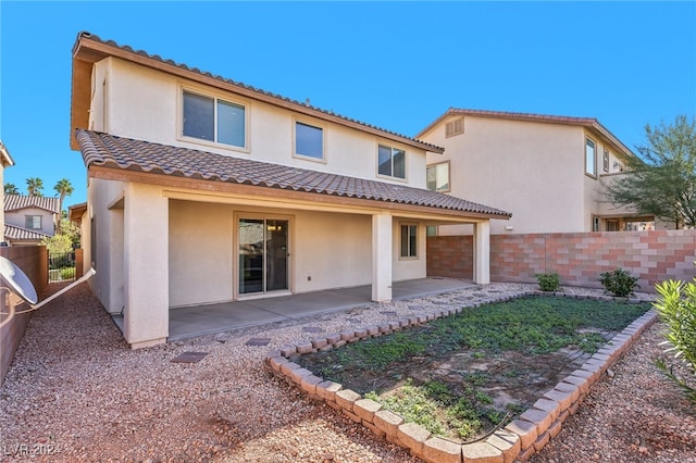 rear view of house with a patio