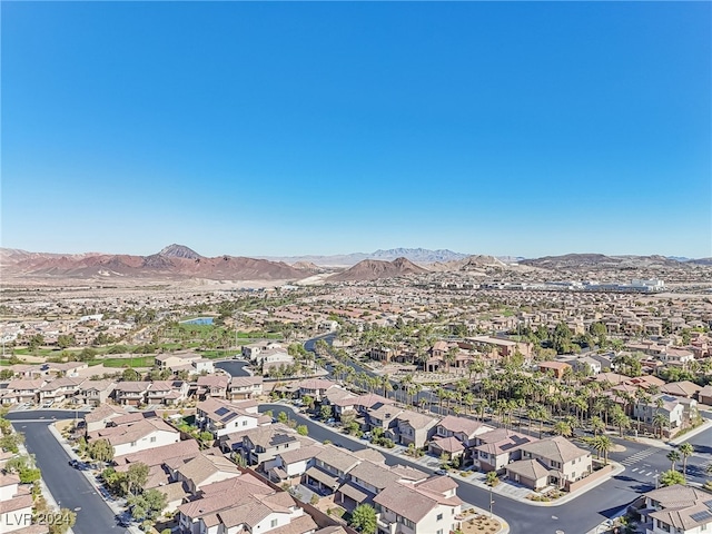 birds eye view of property with a mountain view