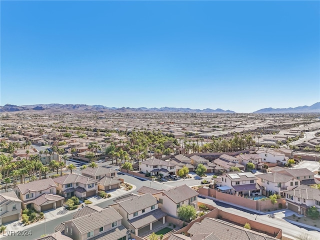 birds eye view of property featuring a mountain view