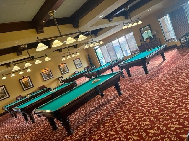 game room with carpet, billiards, a high ceiling, and beam ceiling