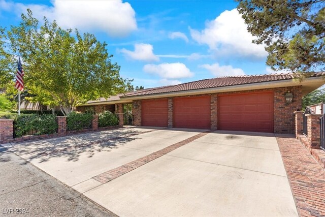 ranch-style home with a garage