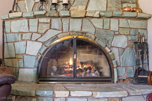 details featuring a stone fireplace