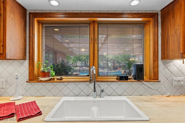 kitchen with decorative backsplash and sink