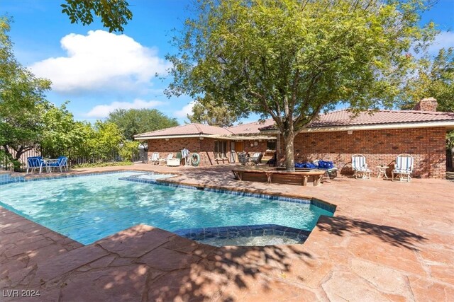 view of swimming pool with a patio area