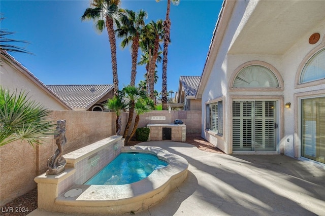 view of swimming pool with a patio