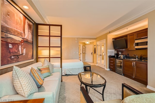 living room with wine cooler, wet bar, and ornamental molding