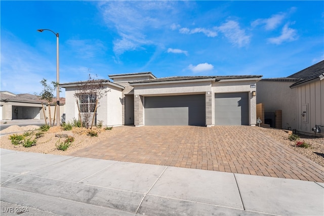 view of front of property with a garage