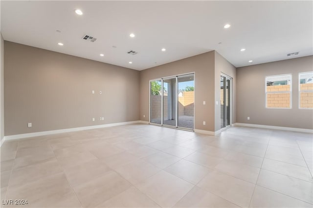 unfurnished room featuring light tile patterned floors