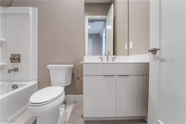 full bathroom featuring tile patterned floors, vanity, toilet, and shower / washtub combination