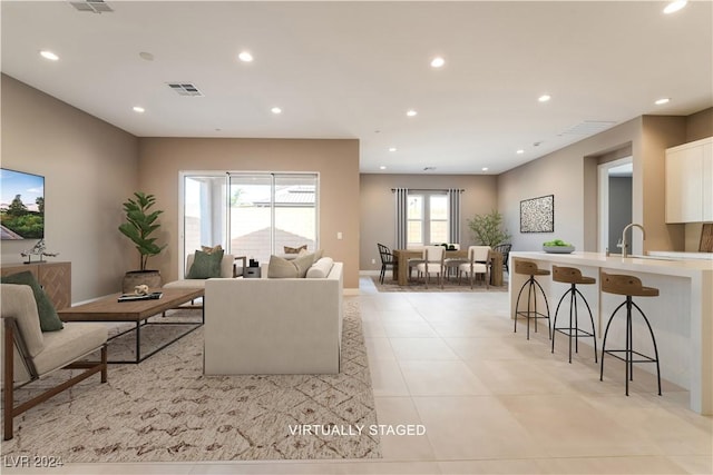 living room with light tile patterned floors