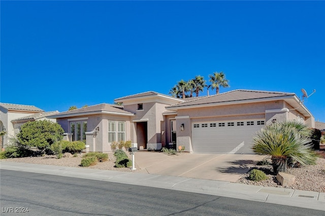 prairie-style house featuring a garage