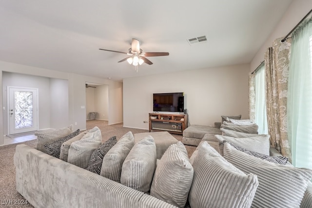 living room with ceiling fan and light carpet