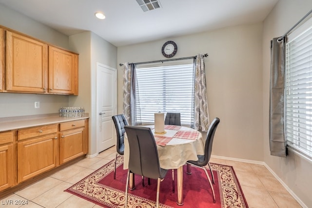 dining area featuring a healthy amount of sunlight and light tile patterned floors