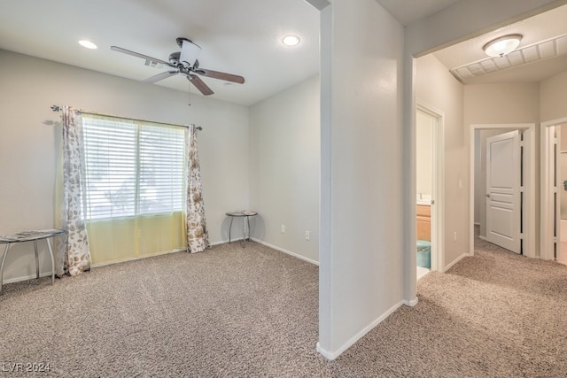 empty room featuring ceiling fan and carpet floors