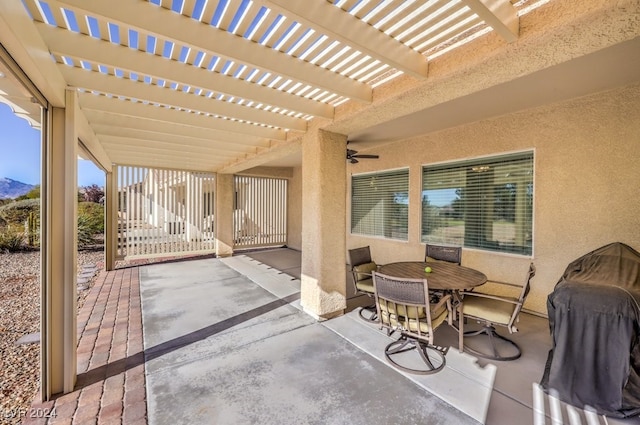 view of patio featuring ceiling fan and a pergola